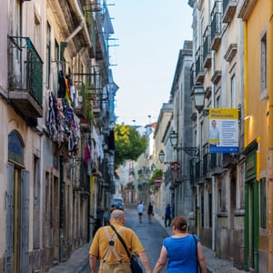 Elderly couple walking hand in hand on a cobblestone street