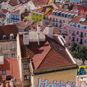 Colorful rooftops of a sunlit hillside city