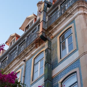Historic building with azulejo tiles and iron balconies