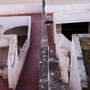 Red steps and weathered walls at an old bullring